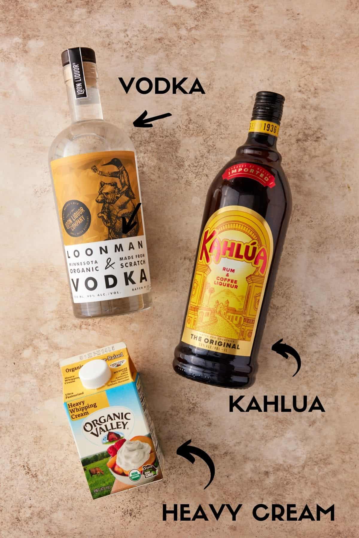 Bottles of Kahlua, vodka and heavy cream.