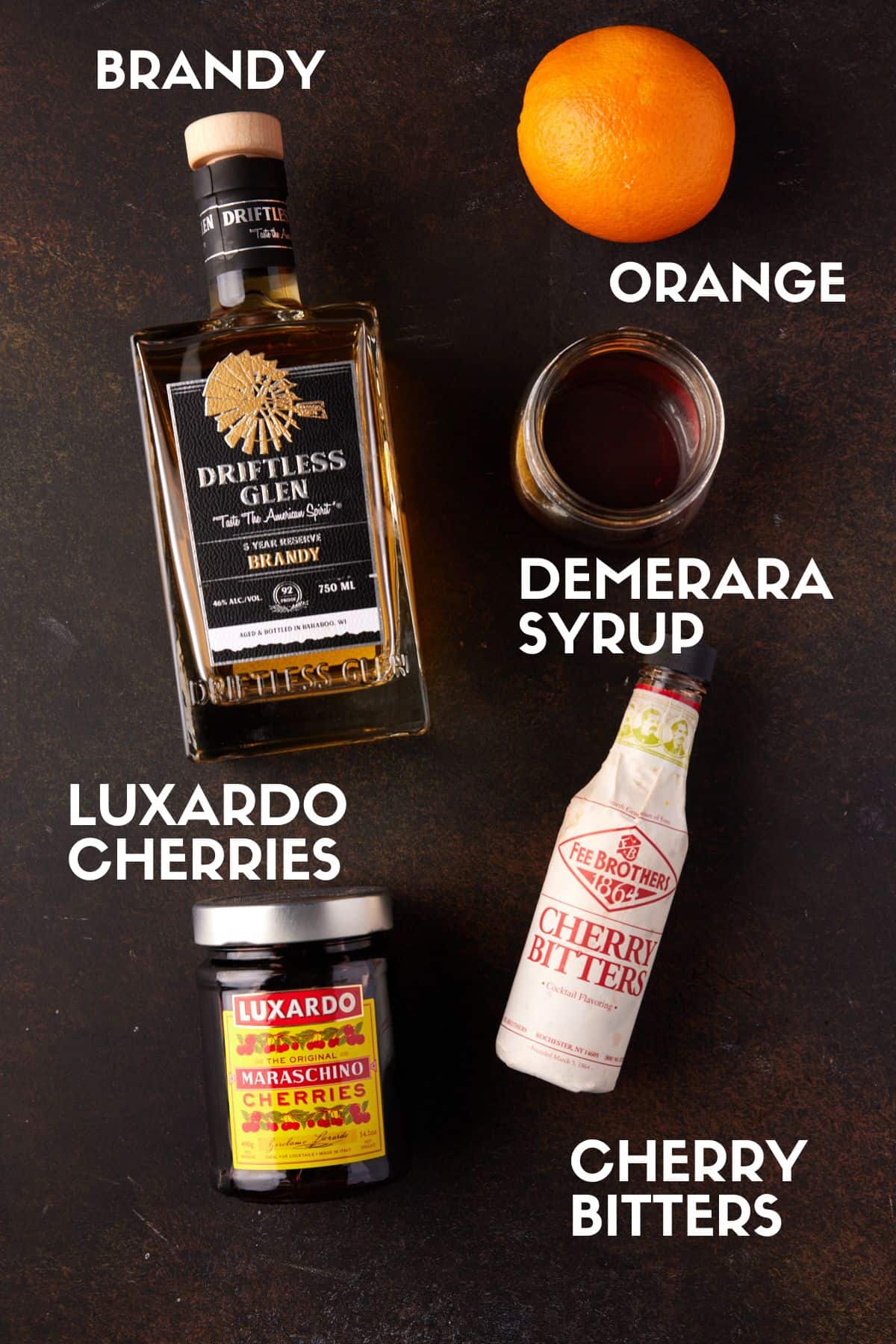 Bottles of ingredients needed to make Brandy Old Fashioned.