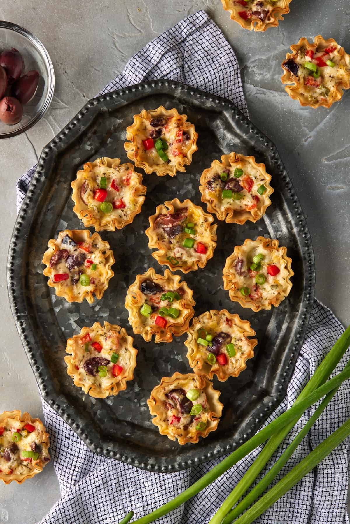 Italian Ranch Phyllo Cups on a platter with olives.