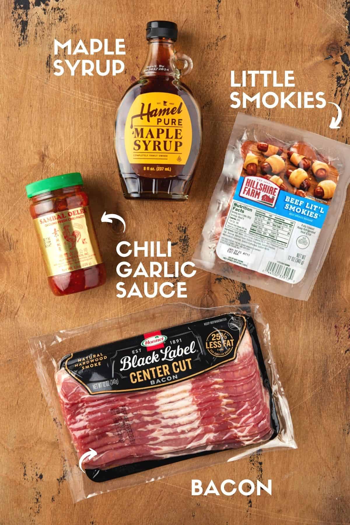 Ingredients for bacon wrapped smokies including bacon, maple syrup, little smokies and chili garlic sauce. 
