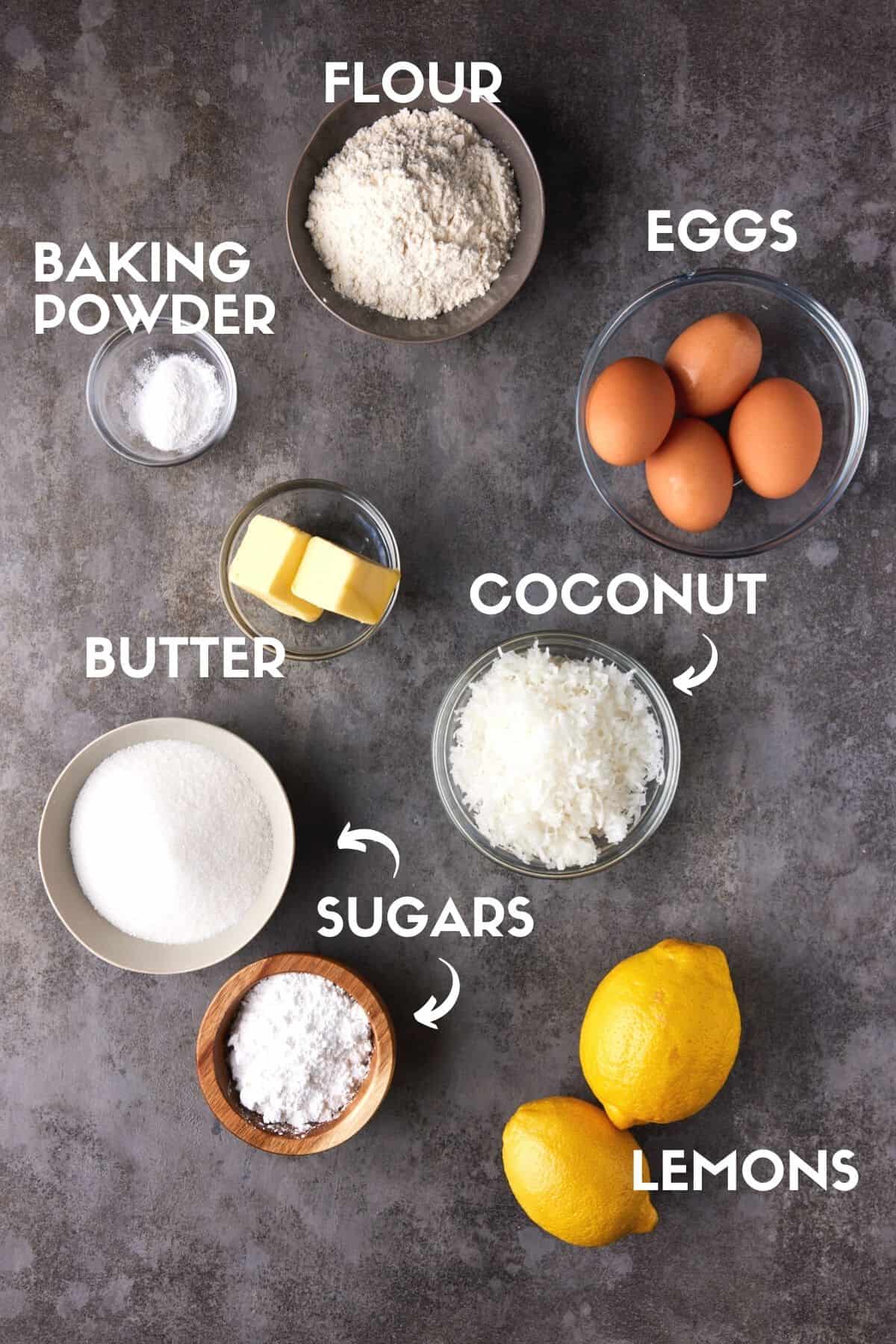 Ingredients for coconut lemon bars including lemons, flour, sugar, eggs and coconut. 