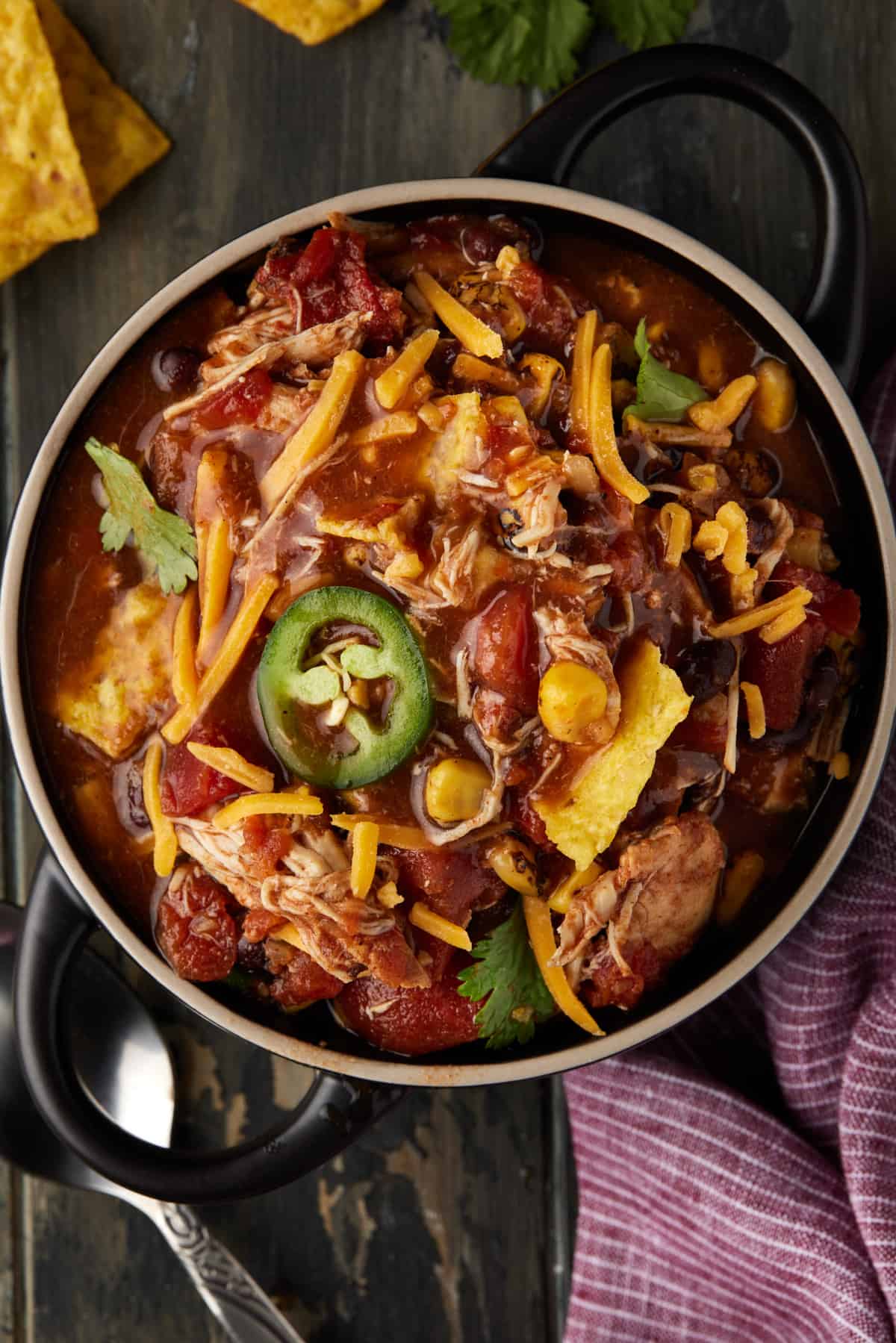 Taco Soup in a bowl with jalapenos.