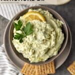 Artichoke dip with crackers.