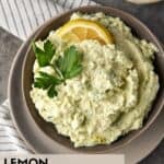 Lemon and parsley on top of artichoke dip.