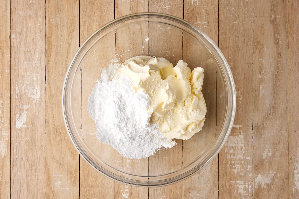 mascarpone cheese and powdered sugar in bowl.
