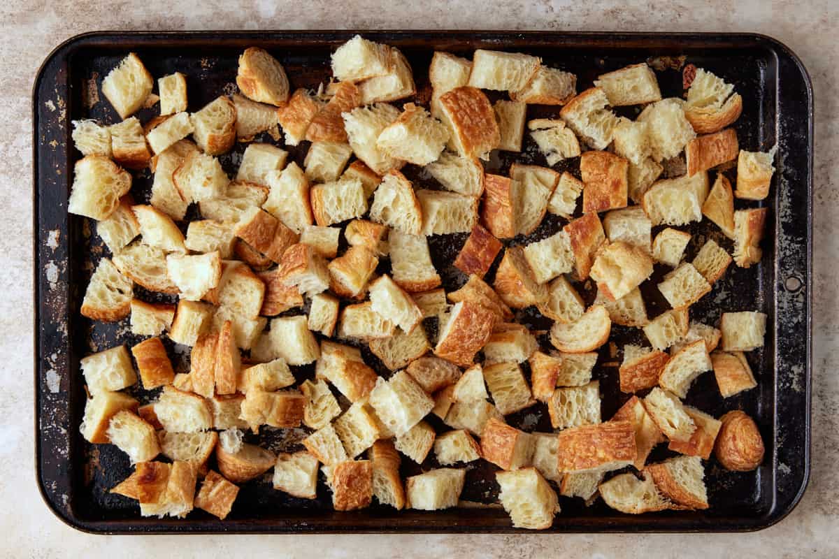 Sheet pan filled with pieces of croissants. 