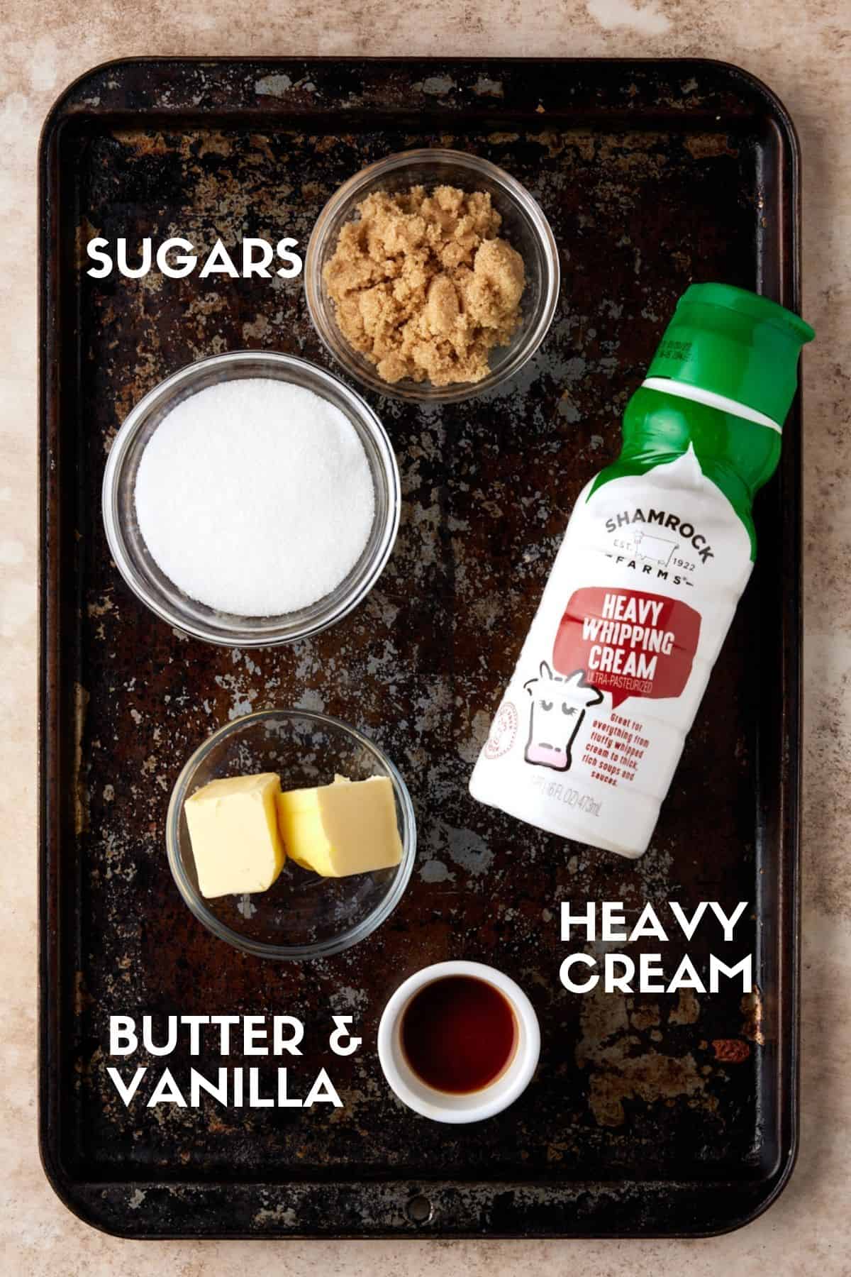 Vanilla sauce ingredients on sheet pan including cream, sugars, butter and vanilla. 