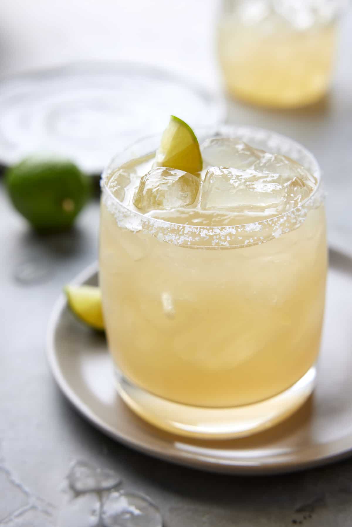 Lime Margarita in low ball glass over ice.