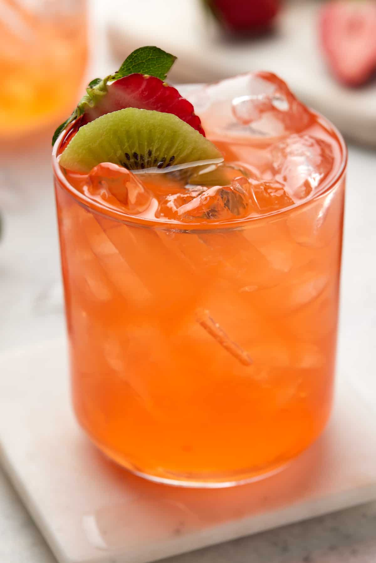 Strawberry Daiquiri with kiwi and fresh strawberries for garnish.