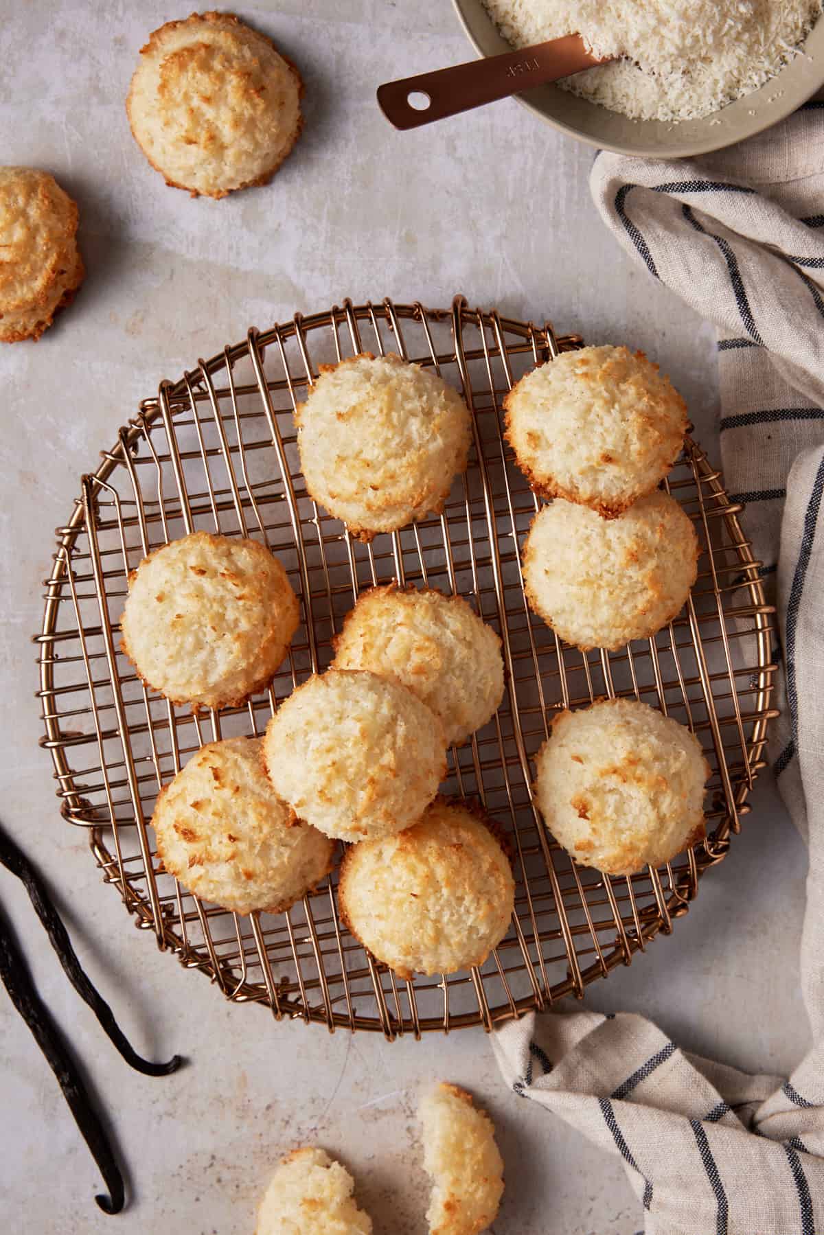 Round copper cooling rack filled with coconut macaroons. 