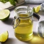 Fruit salad dressing in a glass jar with lid.