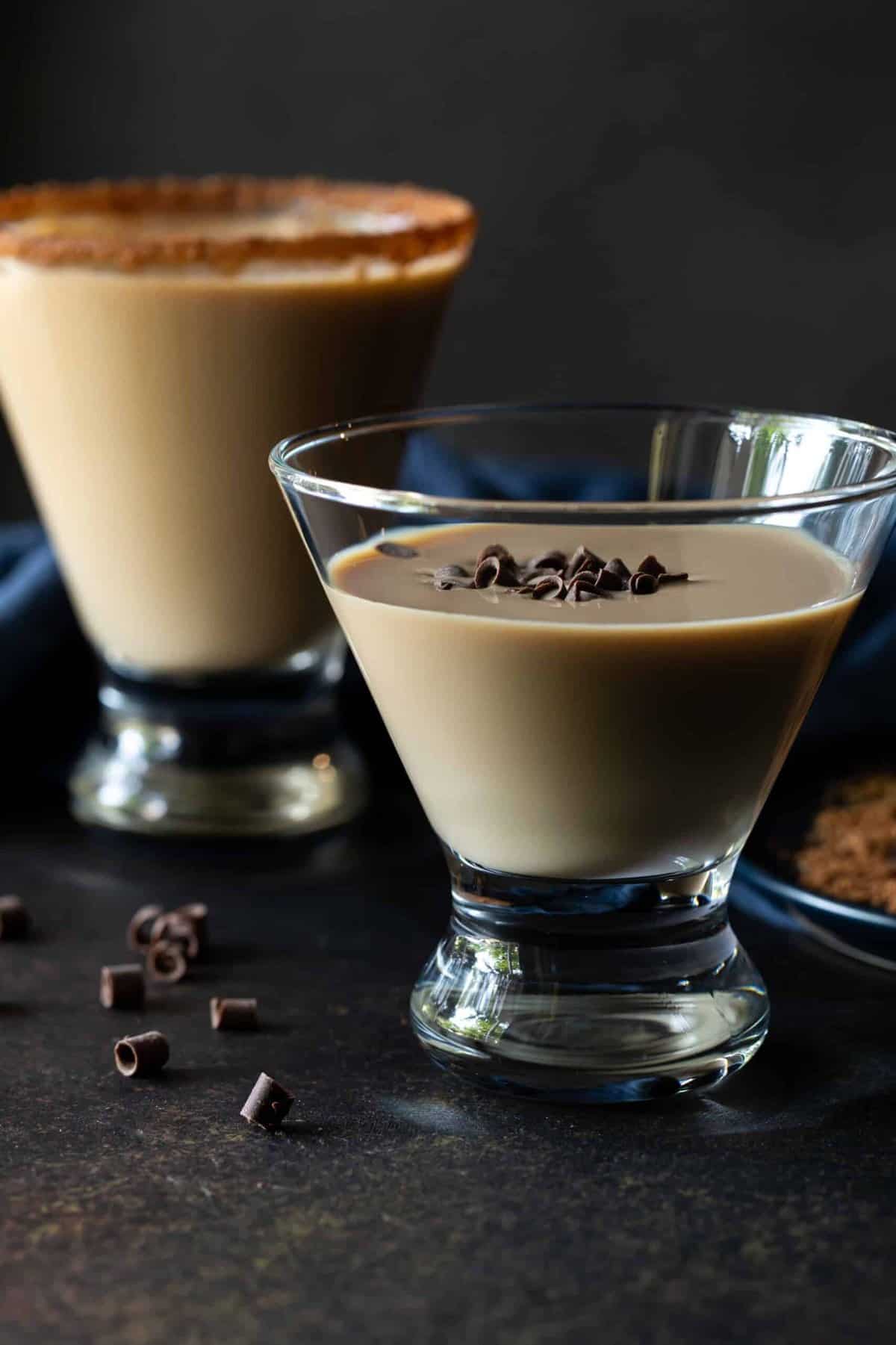 closeup: martinis in stemless martini glasses garnished with chocolate shavings with a cocoa rim