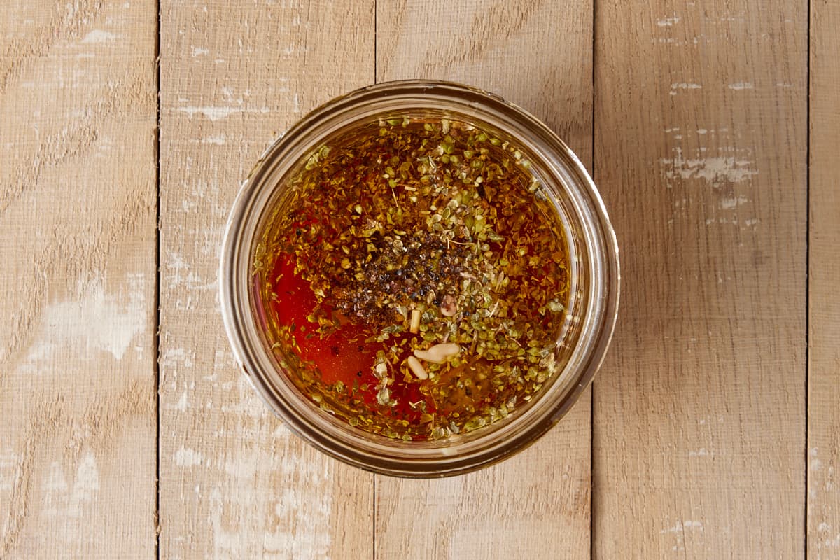 Red wine vinaigrette in a glass jar.