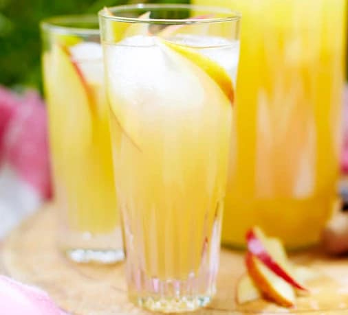 Apple cocktail in highball glass with ice by BBC Good Food.