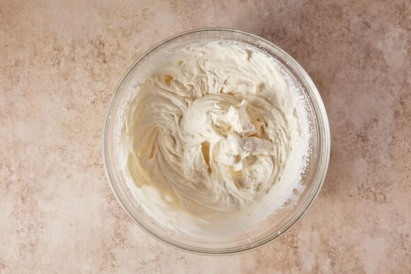 Mascarpone whipped cream in a glass bowl. 