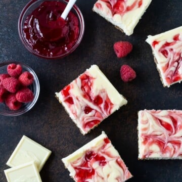 raspberry cheesecake bars cut into squares.