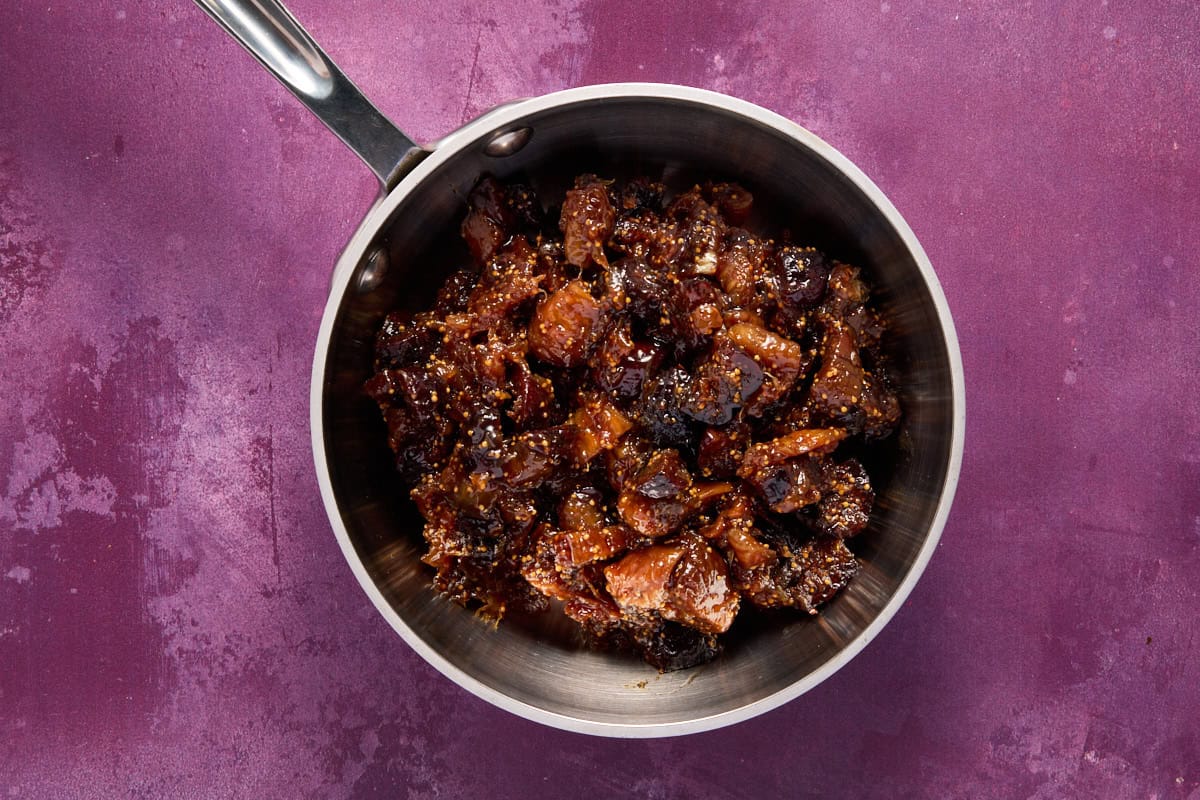 Cooked fig and orange mixture in a small saucepan. 