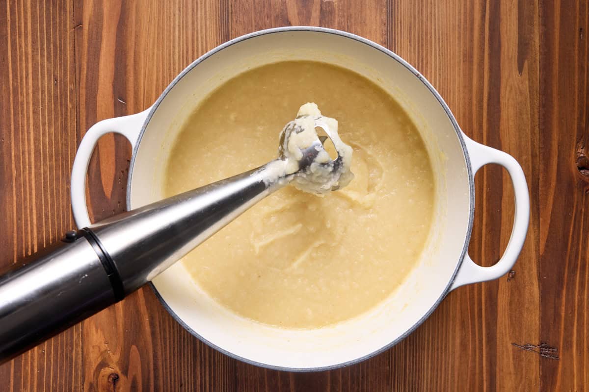 Dutch oven with pureed baked potato soup. 