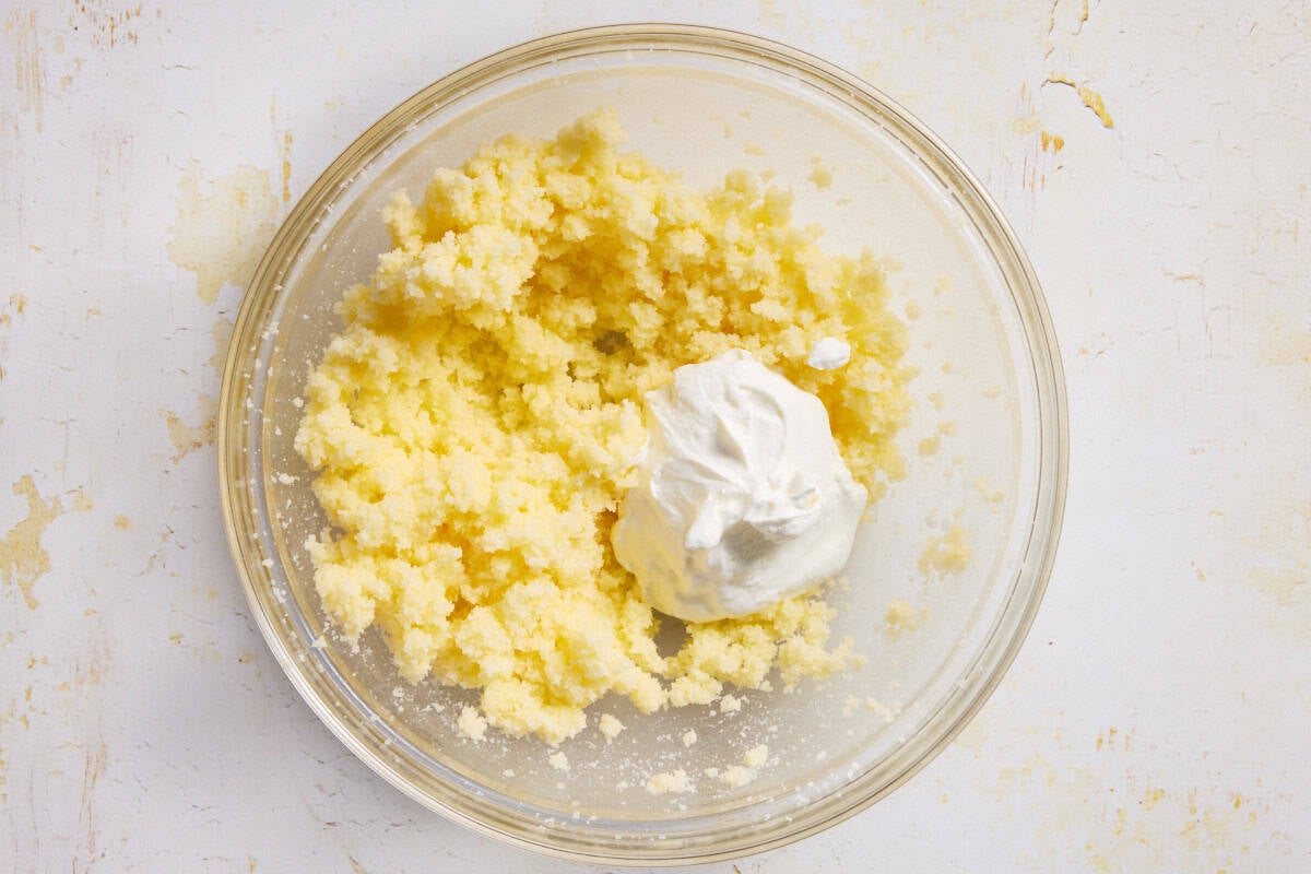 Butter creamed in bowl with sour cream