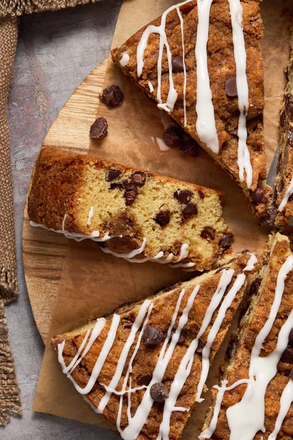 Coffee cake slice on its side showing chocolate chips.
