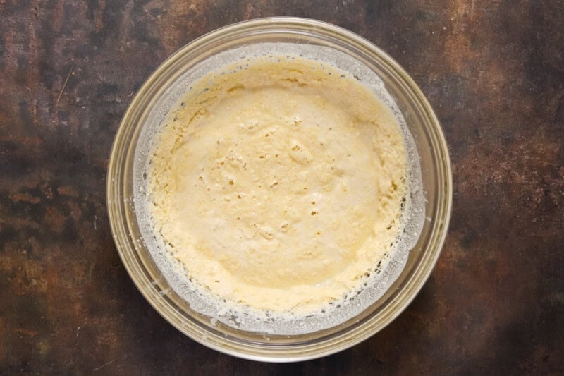 Picture of waffle batter refrigerated overnight in a glass bowl.