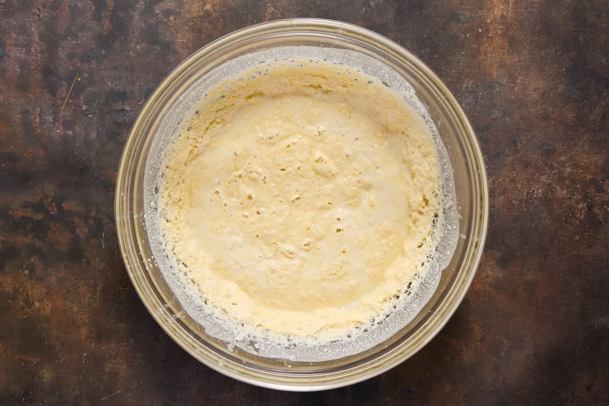 Picture of waffle batter refrigerated overnight in a glass bowl. 