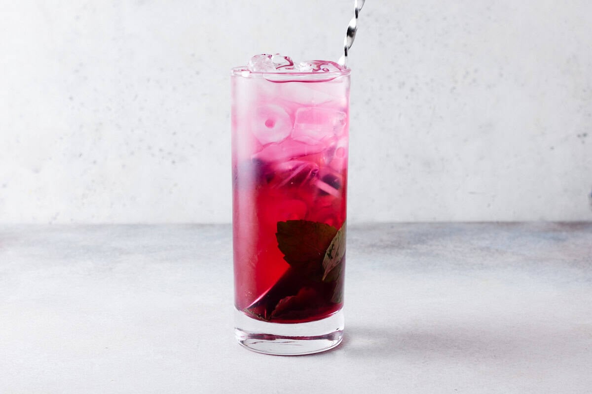 Blueberry mojito with straw ready to drink.