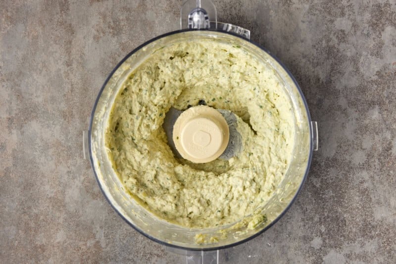 Smooth and creamy artichoke dip in a food processor.