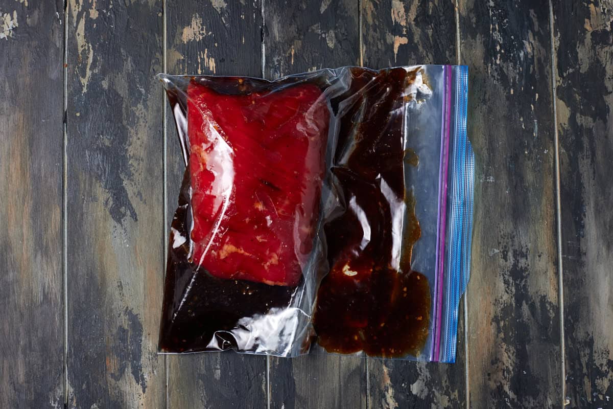 Flank steak marinating in bag.