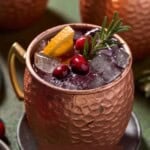 Cranberry Mule in frosty Copper mug with fresh roasemary and cranberries.