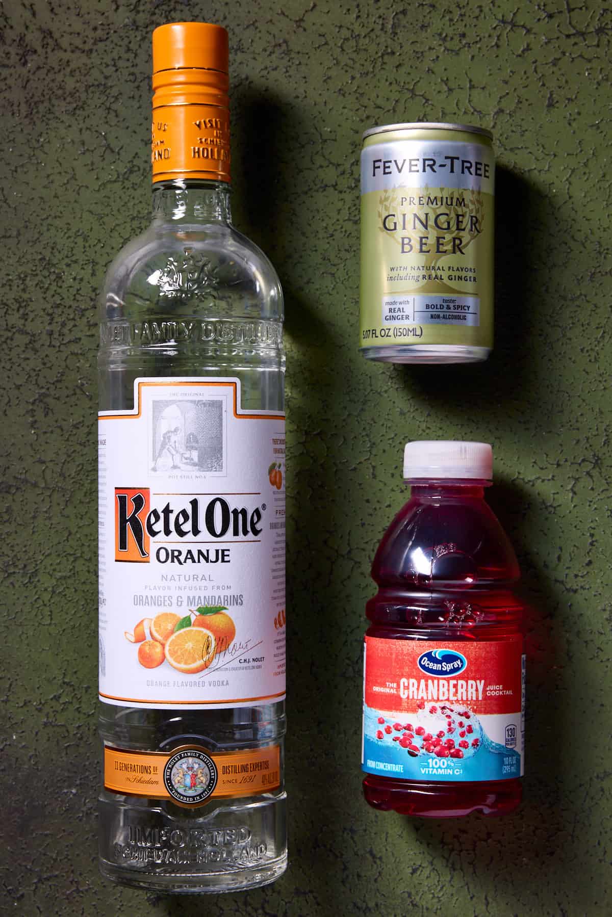 Orange vodka, ginger beer and cranberry juice -ingredients needed to make Cranberry Mule.