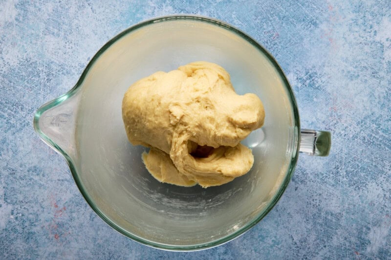Kneaded caramel roll dough in a mixing bowl.
