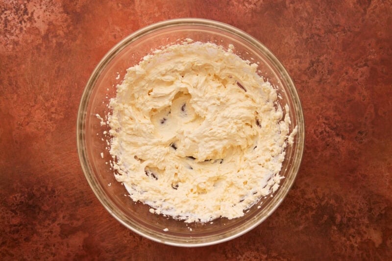 cream cheese, sour cream and mayo creamed together in glass bowl.