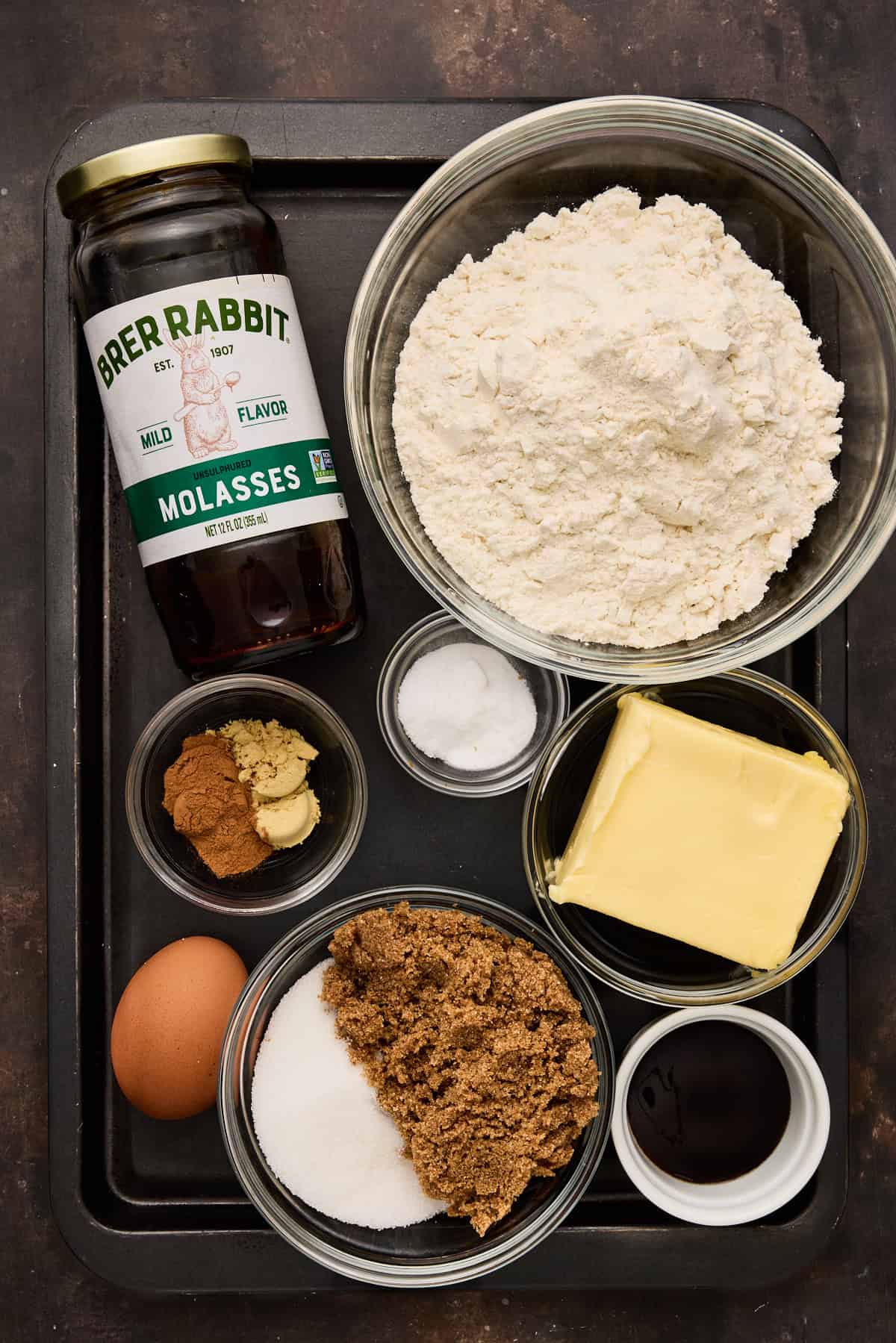 Ingredients needed to make chewy ginger molasses cookies.