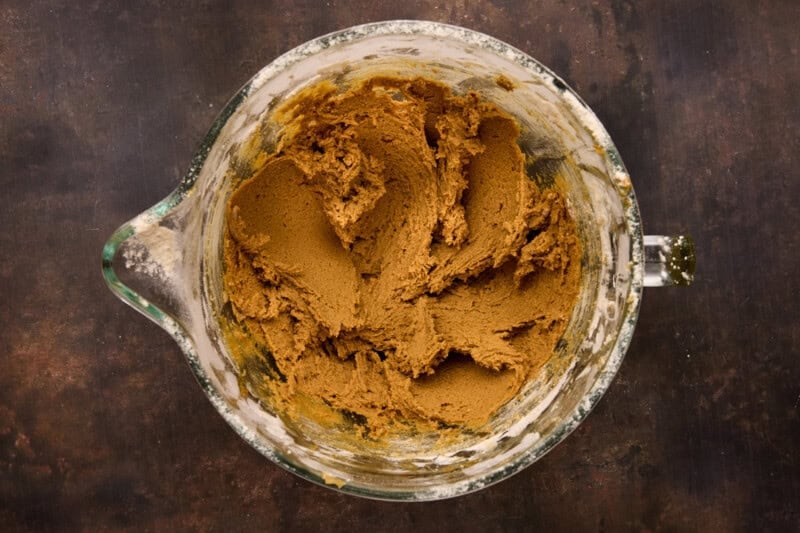 Molasses cookies dough in mixing bowl ready to chill.