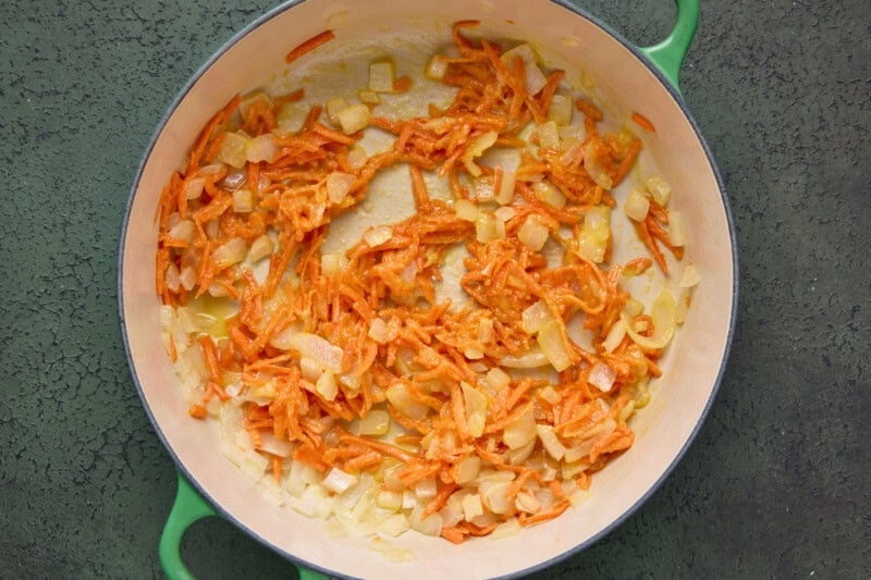 Shredded carrots and diced onion browned in pan with flour.