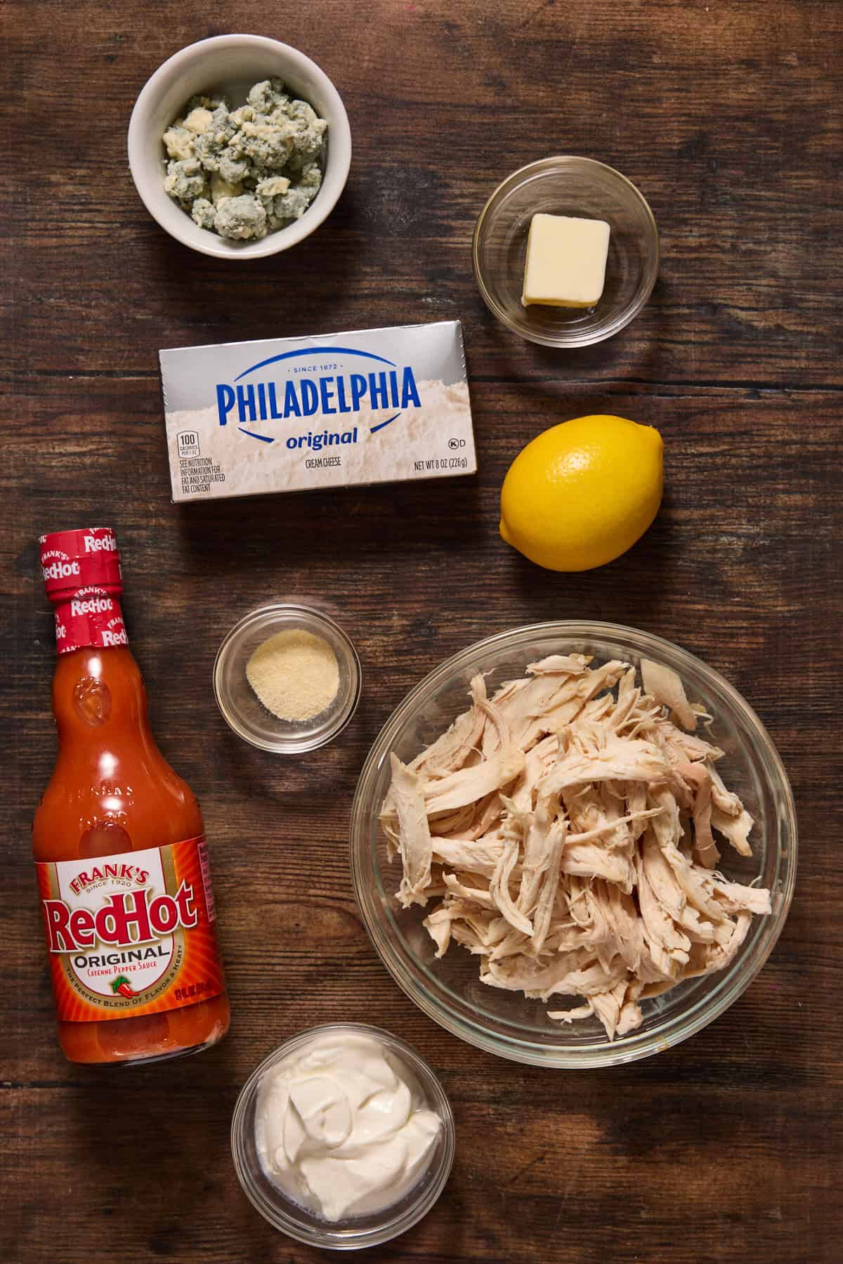 Ingredients needed to make buffalo chicken dip.