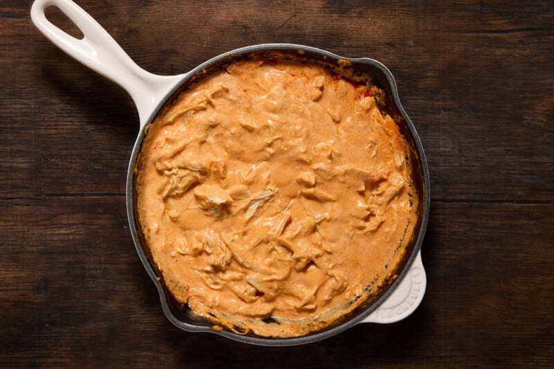 Shredded chicken with Franks red hot sauce, cream cheese, sour cream and spices stirred in.