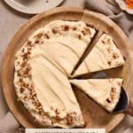 A round single layer carrot cake with brown butter cream cheese frosting on a wooden charger.