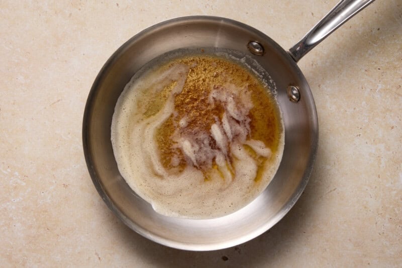 Browned butter in a small stainless steel skillet.