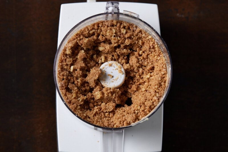 Cinnamon nut streusel in a food processor bowl.