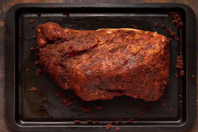 Pork shoulder rubbed with spice mixture.