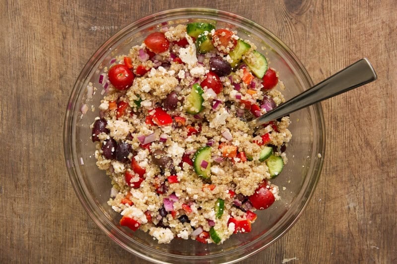 quinoa salad ingredients in bowl, stirred together.