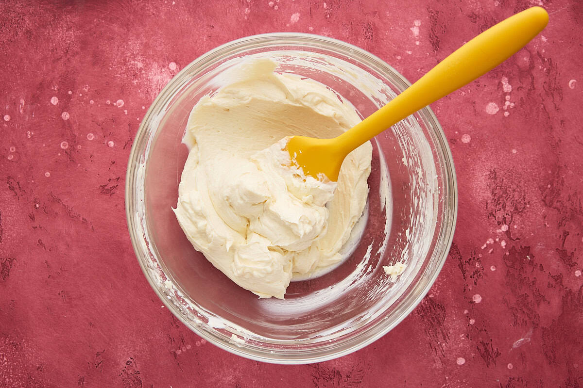 Cheesecake filling in a glass bowl.