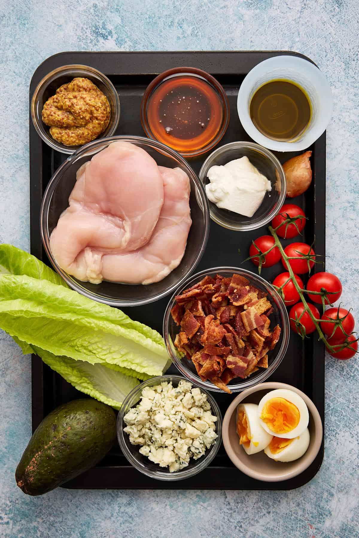 Ingredients needed to make chicken cobb salad.