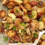 Grilled Potato Salad with Bacon piled high on a beige ceramic plate.