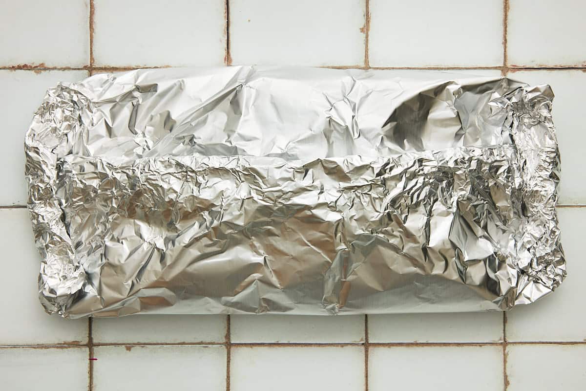 A sealed foil packet of parboiled potatoes.