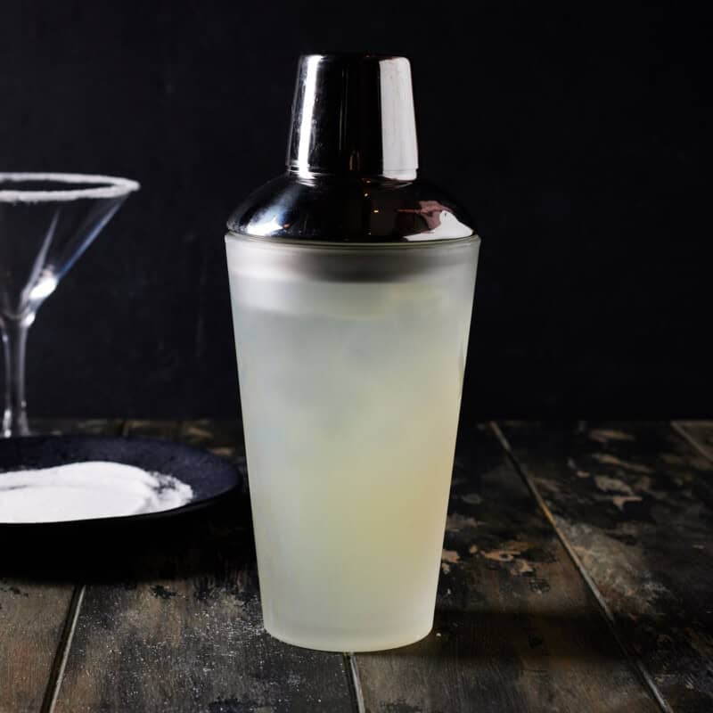 Lemon Drop martini in a shaker that is closed.