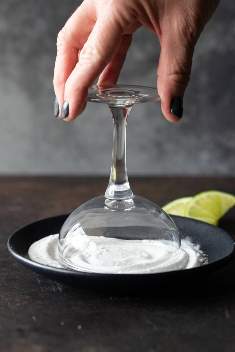 coupe glass inverted on sugar rimmed plate.