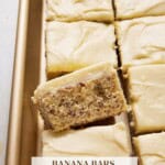 Banana bars with Cream Cheese Frosting in a gold sheet pan.
